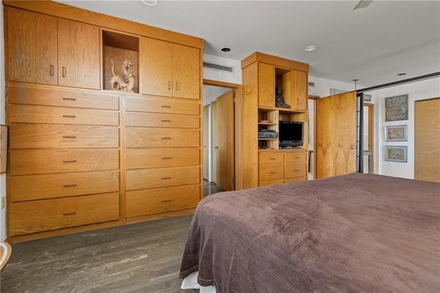 bedroom featuring dark hardwood / wood-style flooring