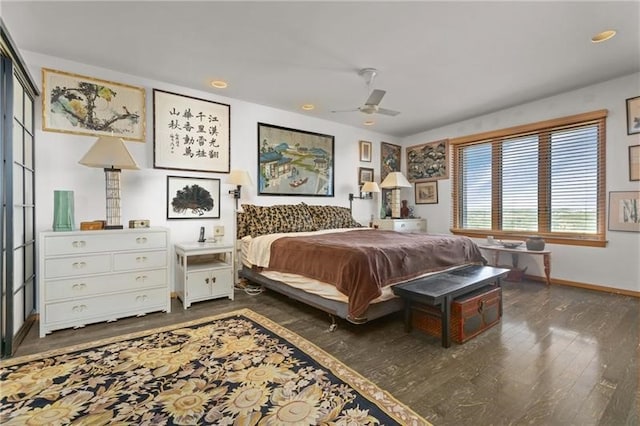 bedroom featuring dark hardwood / wood-style flooring and ceiling fan