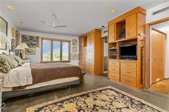 bedroom with ceiling fan and dark hardwood / wood-style flooring