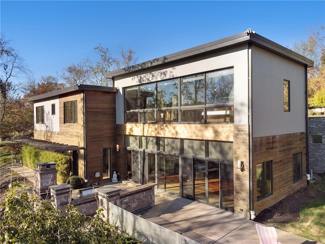 rear view of property featuring a patio