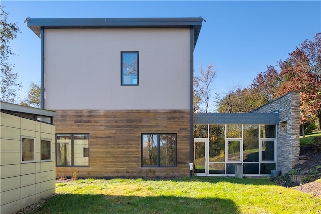 rear view of house with a yard