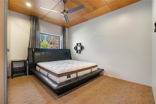 bedroom featuring ceiling fan and light hardwood / wood-style flooring