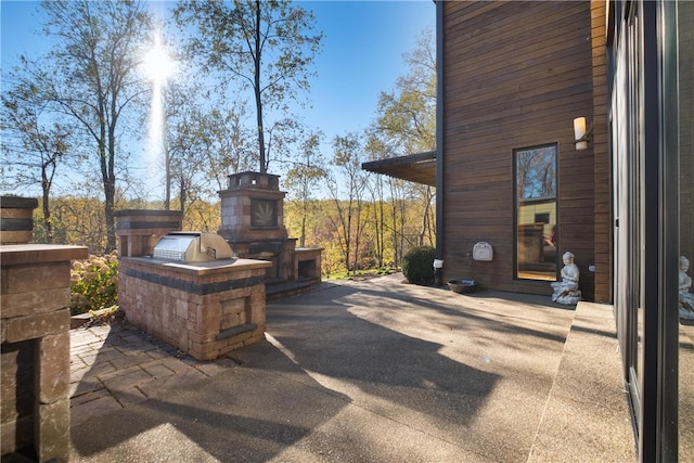 view of patio with a grill