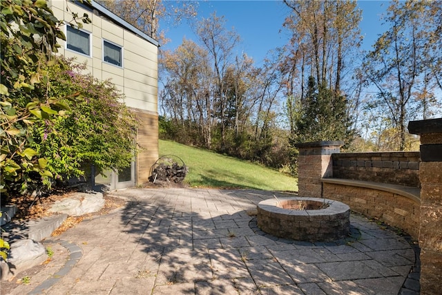 view of patio with a fire pit