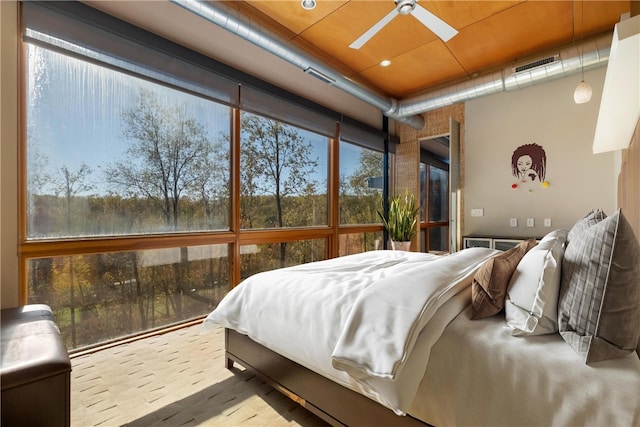 bedroom with ceiling fan and light wood-type flooring