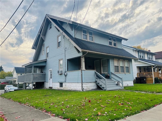 view of front of home with a front lawn and a porch