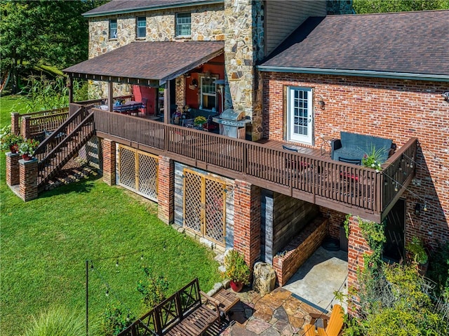 back of house with a lawn and a wooden deck