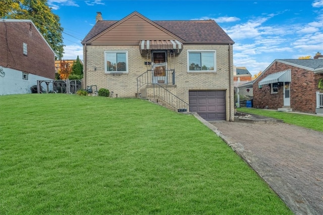 bungalow featuring a front yard and a garage