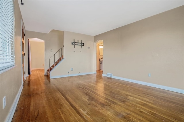 unfurnished living room with hardwood / wood-style flooring