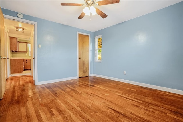 unfurnished bedroom featuring light hardwood / wood-style floors and ceiling fan