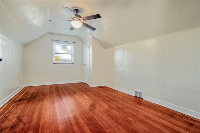 bonus room with lofted ceiling, hardwood / wood-style flooring, and ceiling fan