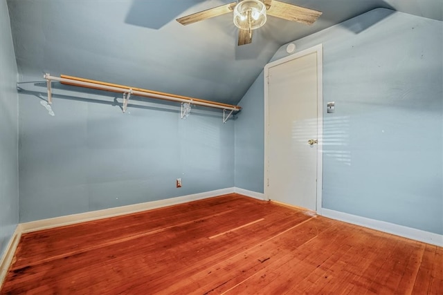 spacious closet featuring lofted ceiling, hardwood / wood-style floors, and ceiling fan