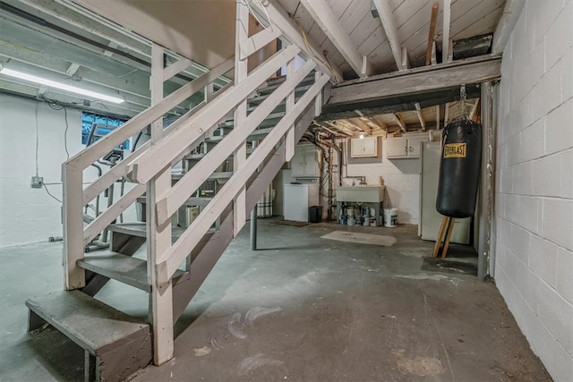 basement with white refrigerator