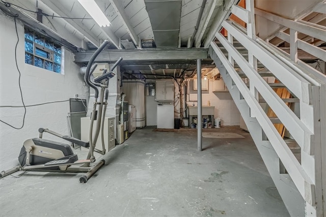 basement featuring electric panel and heating unit