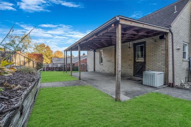 view of yard with a patio and central AC