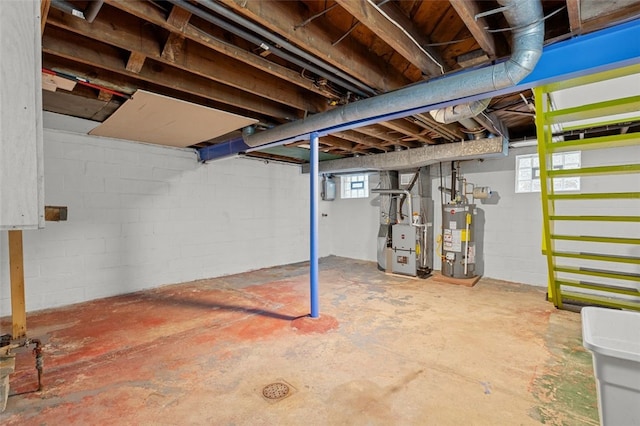 basement featuring water heater and heating unit