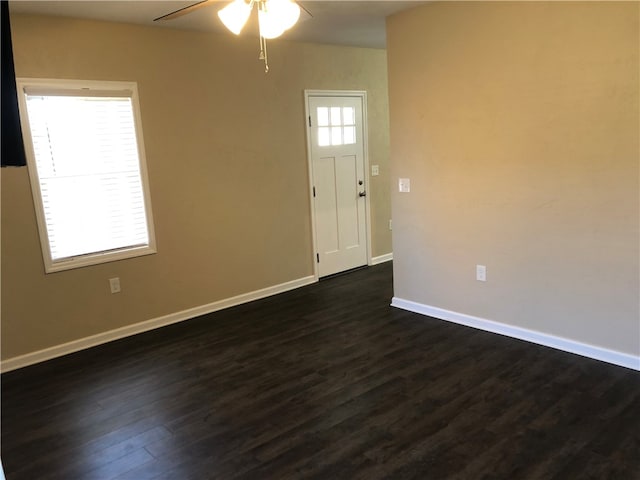 foyer featuring ceiling fan and dark hardwood / wood-style floors