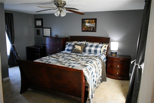 bedroom featuring ceiling fan and carpet floors