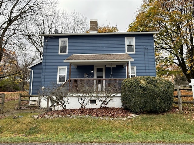 view of front facade with a porch and a front yard