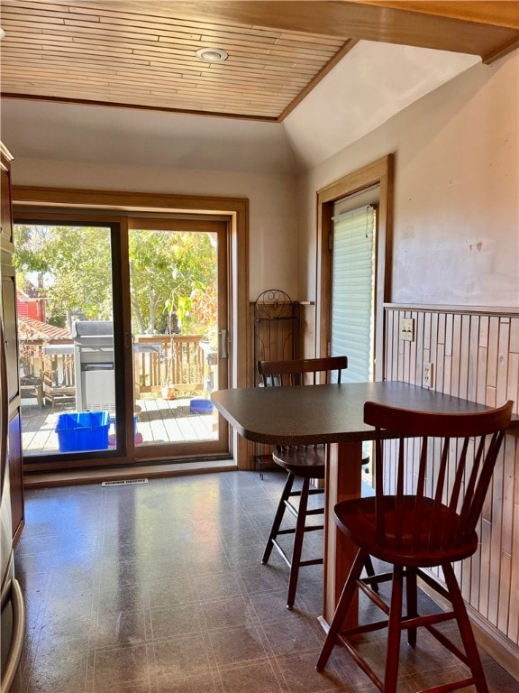 dining area with wooden ceiling