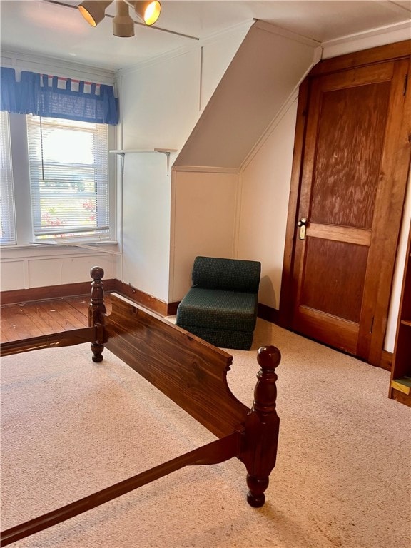 bedroom featuring hardwood / wood-style flooring, ceiling fan, and crown molding