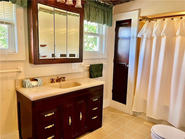 full bathroom with toilet, shower / bath combination with curtain, vanity, and tile patterned floors