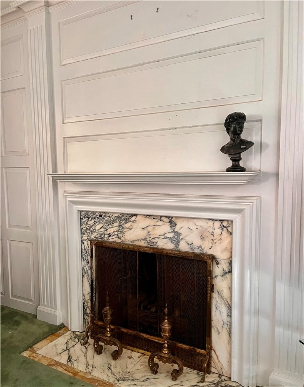 interior details featuring a high end fireplace