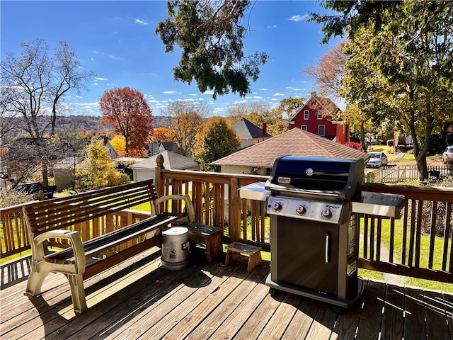 wooden terrace with area for grilling