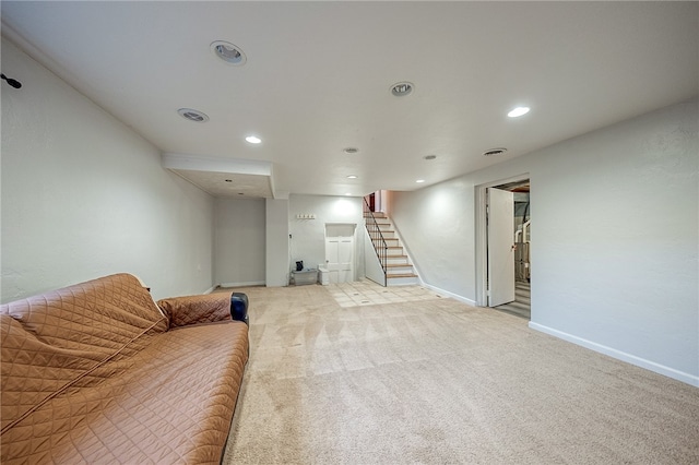 unfurnished living room featuring light carpet