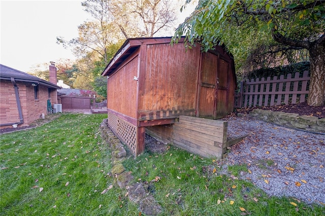 view of outbuilding with a yard