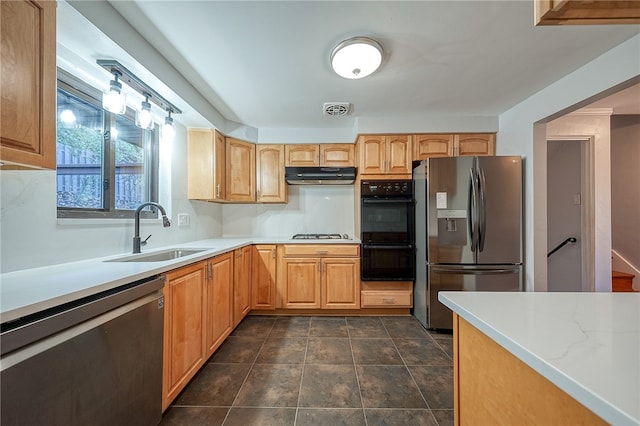 kitchen with sink and appliances with stainless steel finishes