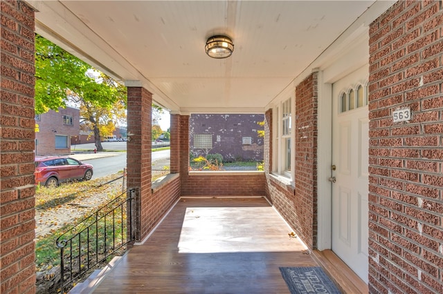 wooden terrace featuring a porch