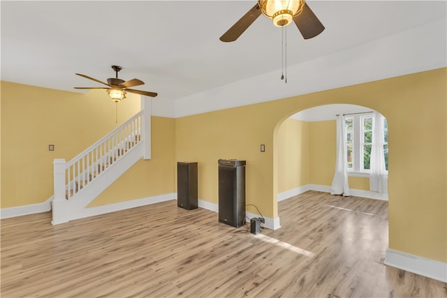 unfurnished living room featuring light wood-type flooring and ceiling fan