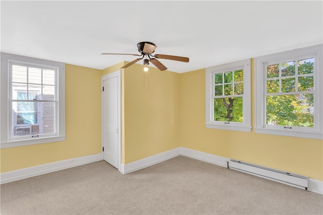 unfurnished room with light carpet, a baseboard radiator, plenty of natural light, and ceiling fan