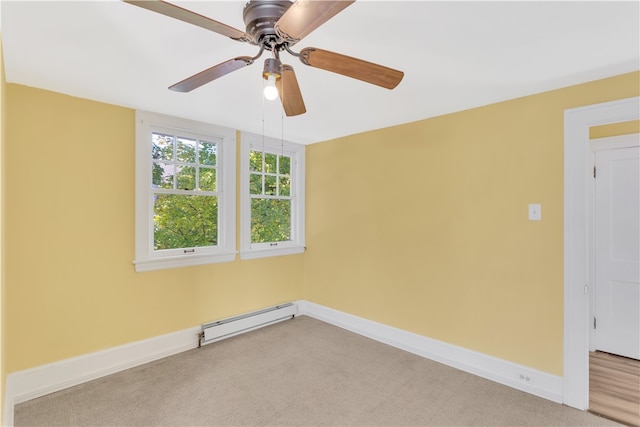 unfurnished room with light carpet, a baseboard radiator, and ceiling fan