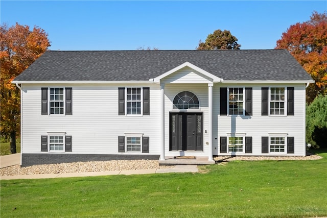 split foyer home with a front yard