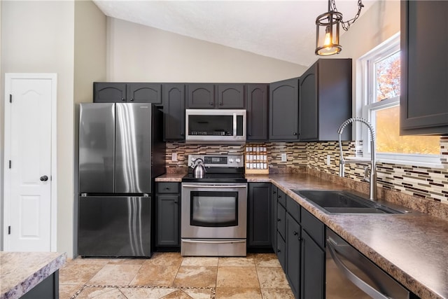 kitchen with sink, backsplash, hanging light fixtures, stainless steel appliances, and vaulted ceiling