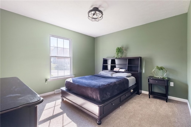 bedroom featuring light colored carpet