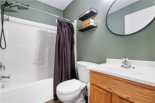 full bathroom with vanity, shower / bath combo, and toilet