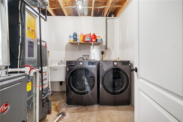 laundry room featuring sink and separate washer and dryer