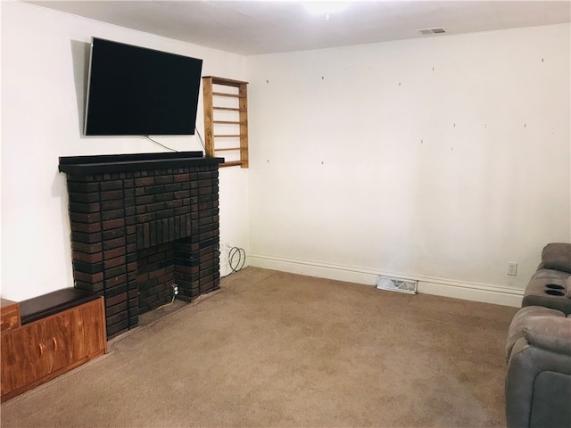 carpeted living room featuring a brick fireplace