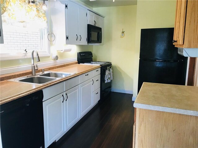 kitchen with black appliances, sink, dark hardwood / wood-style floors, and white cabinets