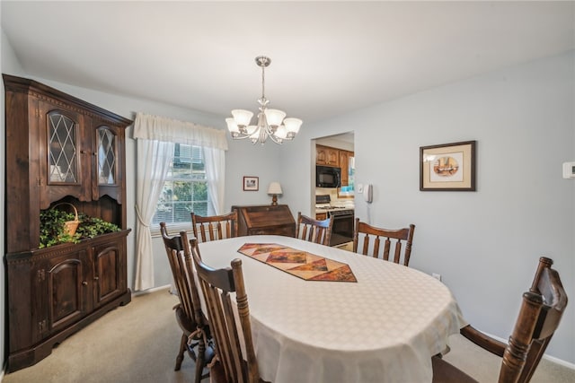 dining space with light carpet and an inviting chandelier