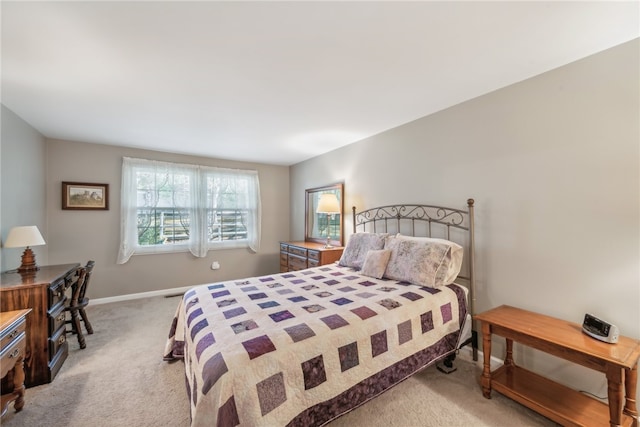 bedroom featuring light colored carpet