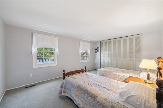 carpeted bedroom featuring a closet