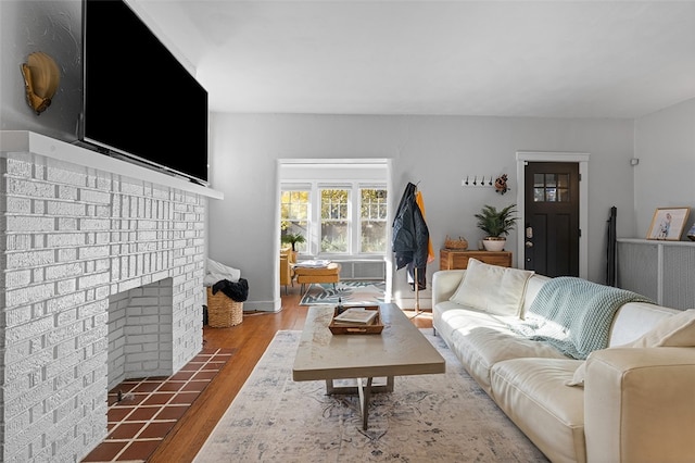 living room featuring hardwood / wood-style floors and a fireplace