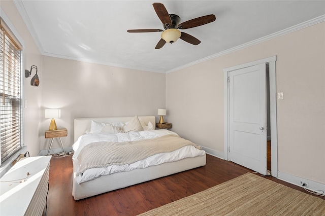 bedroom featuring crown molding, hardwood / wood-style flooring, and ceiling fan