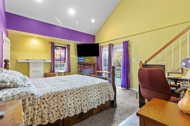 carpeted bedroom featuring high vaulted ceiling