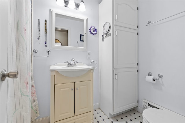 bathroom featuring vanity, toilet, and a shower with curtain