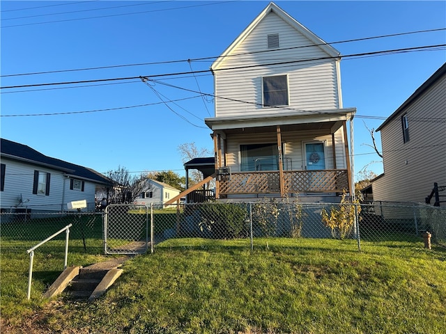 rear view of property with a lawn and covered porch